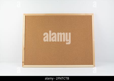 a cork board for notes on white background Stock Photo