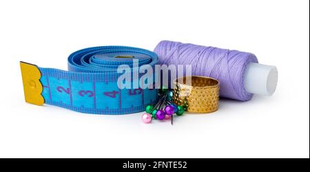 Tailor, needles and threads over white background Stock Photo