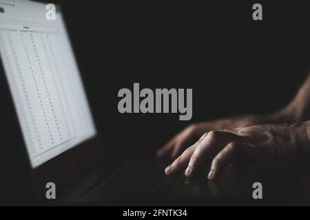 Man type on laptop keyboard. Person working on computer. Close up shot of hands and keyboard Stock Photo