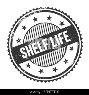 SHELF LIFE text written on black grungy zig zag borders round stamp. Stock Photo