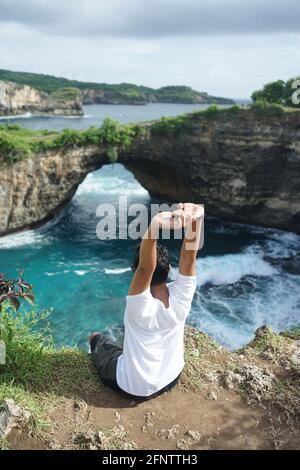 Sitting Relaxing view Broken Beach Bali Indonesia Stock Photo