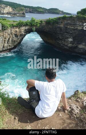 Sitting Relaxing view Broken Beach Bali Indonesia Stock Photo