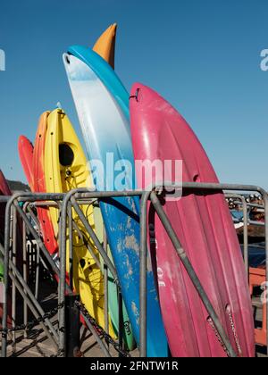 Surfboards and canoes available for hire near Lyme Regis Beach, Lyme Regis, Dorset, United Kingdom, 2019. Stock Photo