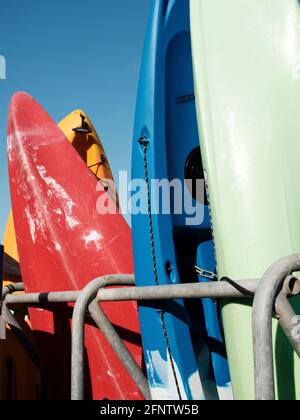 Surfboards and canoes available for hire near Lyme Regis Beach, Lyme Regis, Dorset, United Kingdom, 2019. Stock Photo