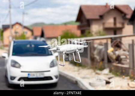 Unmanned modern drone, wide application of drones.-Recording of hard-to-reach places, transport of small things, reconnaissance of the terrain. Stock Photo