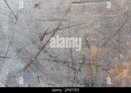 Paint, streaks and scratches on a gray wall Stock Photo