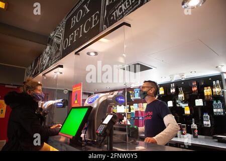 London, UK, 19 May 2021: The Clapham Picturehouse cinema reopens today with a tentative lunchtime audience but screenings quite well booked for evening shows. The screens will opperate at less than 50% of capacity for social distancing and audiences are required to wear face masks. Anna Watson/Alamy Live News