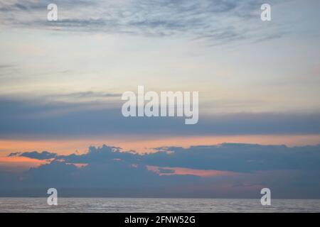 dramatic red sunset over the baltic sea shore Stock Photo