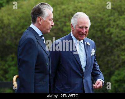 The Prince of Wales with Lord Caledon (left) as he arrives for his visit to Caledon where he viewed the sites of upcoming development projects around the village. Picture date: Wednesday May 19, 2021. Stock Photo