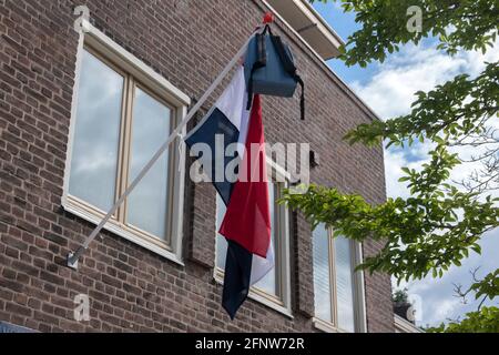 Schoolbag Hanging On A Flag At Amsterdam The Netherlands Stock Photo