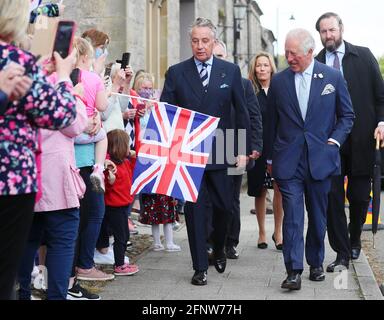 The Prince of Wales with Lord Caledon (left) during his visit to Caledon where he viewed the sites of upcoming development projects around the village. Picture date: Wednesday May 19, 2021. Stock Photo