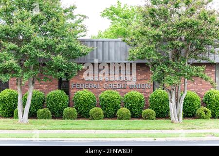 CHATTANOOGA, TN, USA-8 MAY 2021: Chattanooga Area Schools Federal Credit Union.  Tight shot of sign on building.  Foliage surrounding. Stock Photo