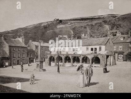 A late 19th Century view of the Shambles in Settle in the West Riding of Yorkshire, England. Built  around 1780 as a row of shops with single-storey cottages above and basements below, the cottages were partially demolished and reconfiguredin 1888 by adding an upper storey and removing the external north stairway. Stock Photo