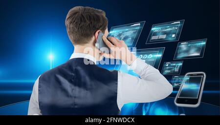 Composition of businessman talking on smartphone over digital screens with data processing Stock Photo