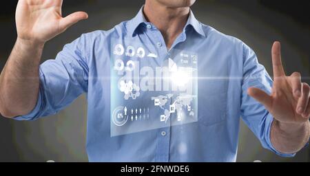 Composition of information on screen over midsection of man using virtual interface Stock Photo