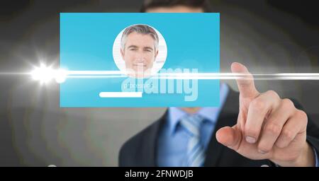 Composition of businessman touching interactive screen with photograph processing Stock Photo