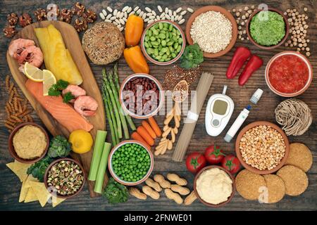 Low glycemic testing & lancing devices with healthy food for diabetics below 55 on the GI index. Stock Photo