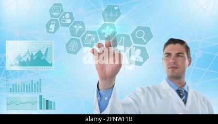Composition of male doctor touching screen with medical data processing Stock Photo