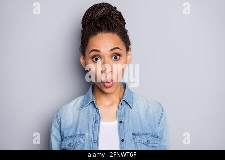 Photo portrait of african american amazed woman isolated on clear grey colored background Stock Photo