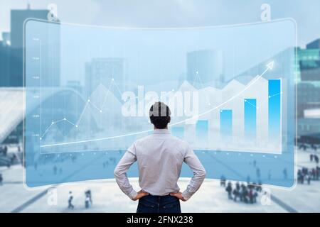 Financial data showing growing revenue and successful business strategy. Finance analyst or executive manager analyzing profit on chart report with ci Stock Photo