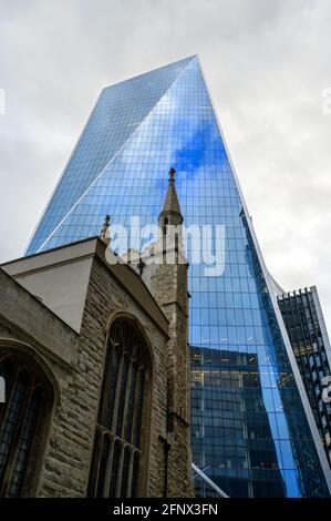 London, UK: The Scalpel building in the City of London. View of the Scalpel or 52 Lime Street with St Andrew Undershaft Church in foreground. Stock Photo