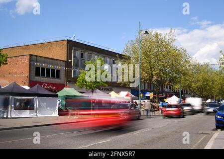 St Albans-UK - 19 May 2021 - People shopping and walking on busy retail high street with market stalls and shops Stock Photo