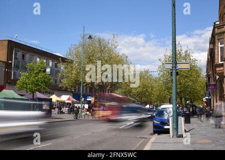 St Albans-UK - 19 May 2021 - People shopping and walking on busy retail high street with market stalls and shops Stock Photo