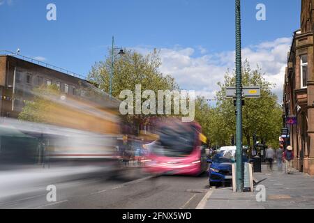 St Albans-UK - 19 May 2021 - People shopping and walking on busy retail high street with market stalls and shops Stock Photo