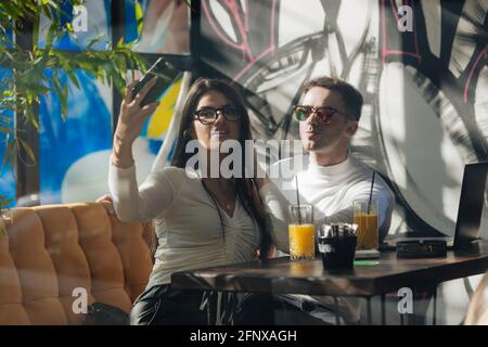 Co-workers spending time together on a break while working on a project on a lovely sunny day. Stock Photo