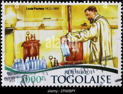 Louis Psteur at work on postage stamp Stock Photo