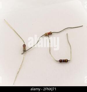 miniature resistors on white background. Passive two terminal electrical components