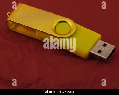 colored USB pendrive on red background Stock Photo