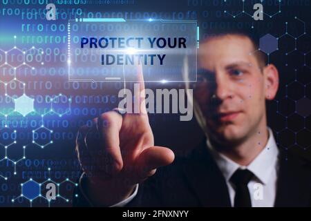 Business, Technology, Internet and network concept. Young businessman working on a virtual screen of the future and sees the inscription: Protect your Stock Photo