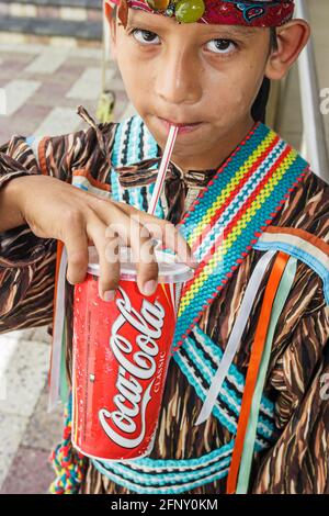 Florida Hollywood Ft. Fort Lauderdale,Seminole Hard Rock Casino Hotel & Resort,Native American Indian boy drinking Coke Coca Cola cup straw,Okalee Ind Stock Photo