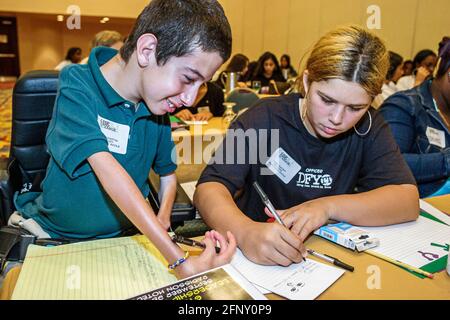 Miami Florida,Drug Free Youth In Town DFYIT Leadership Conference,teens teenage teenagers students scrapbook session disabled boy male, Stock Photo