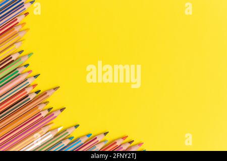 Coloring pencils isolated on yellow background close up concept with copy space for text Stock Photo