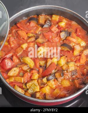 Vertical shot of pisto Spanish vegetable stew on a casserole Stock Photo