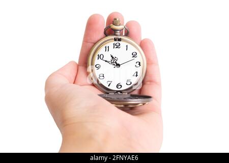 Close-up on a bronze pocket watch in hand isolated on a white background Stock Photo