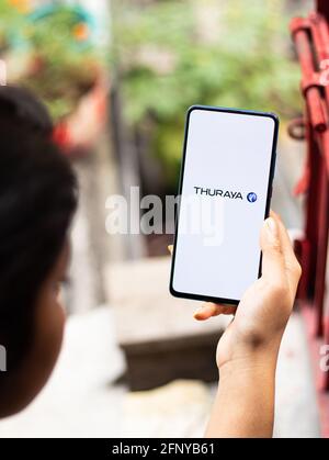 Assam, india - May 18, 2021 : Thuraya logo on phone screen stock image. Stock Photo