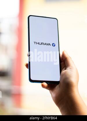 Assam, india - May 18, 2021 : Thuraya logo on phone screen stock image. Stock Photo