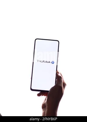 Assam, india - May 18, 2021 : Thuraya logo on phone screen stock image. Stock Photo