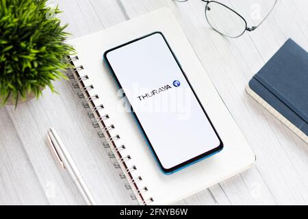 Assam, india - May 18, 2021 : Thuraya logo on phone screen stock image. Stock Photo