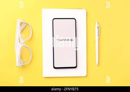 Assam, india - May 18, 2021 : Thuraya logo on phone screen stock image. Stock Photo