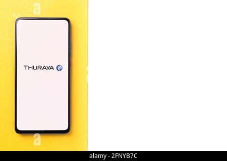 Assam, india - May 18, 2021 : Thuraya logo on phone screen stock image. Stock Photo