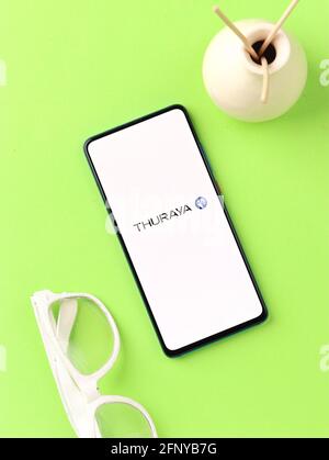 Assam, india - May 18, 2021 : Thuraya logo on phone screen stock image. Stock Photo