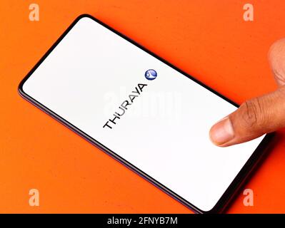 Assam, india - May 18, 2021 : Thuraya logo on phone screen stock image. Stock Photo