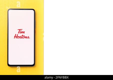 Assam, india - May 18, 2021 : Tim Hortons logo on phone screen stock image. Stock Photo