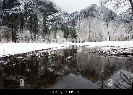 Yosemite Valley in the winter with the Merced River and Upper Yosemite Falls in the background Stock Photo