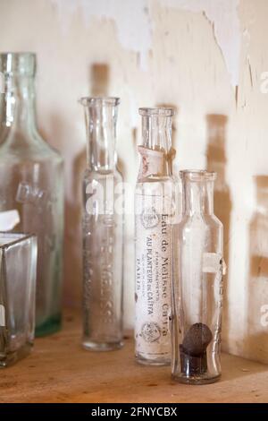 19th century empty bottles on a shelf. Stock Photo