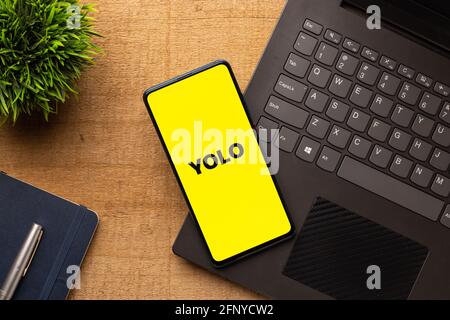 Assam, india - May 18, 2021 : Yolo logo on phone screen stock image. Stock Photo